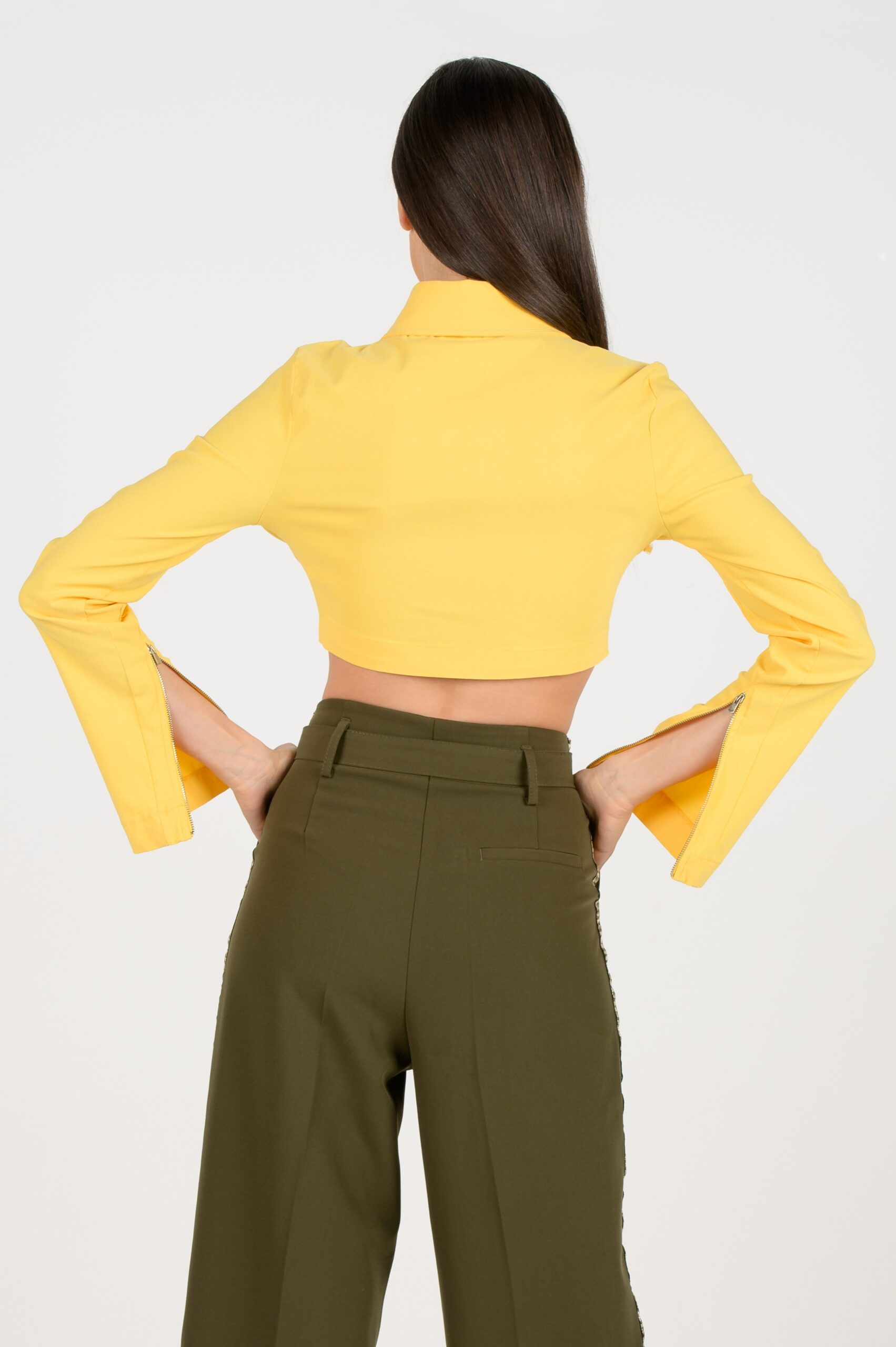 Yellow Cropped Shirt with zippers on the sleeves, back side.