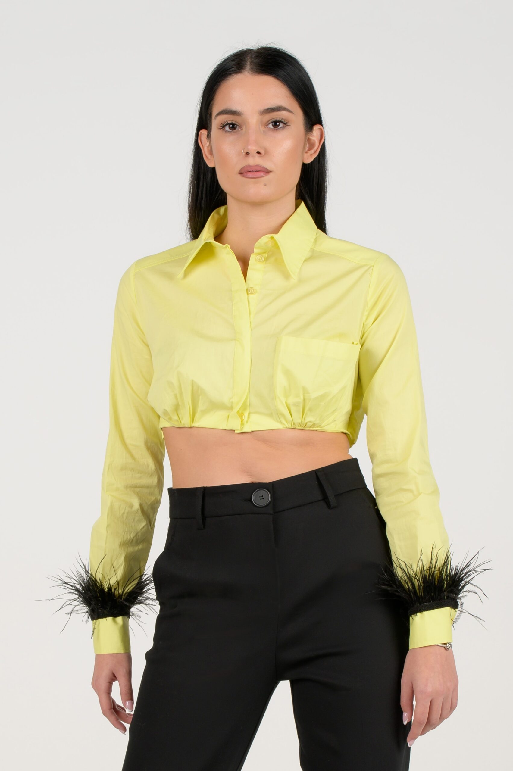 Cropped yellow shirt with feathers on the sleeves