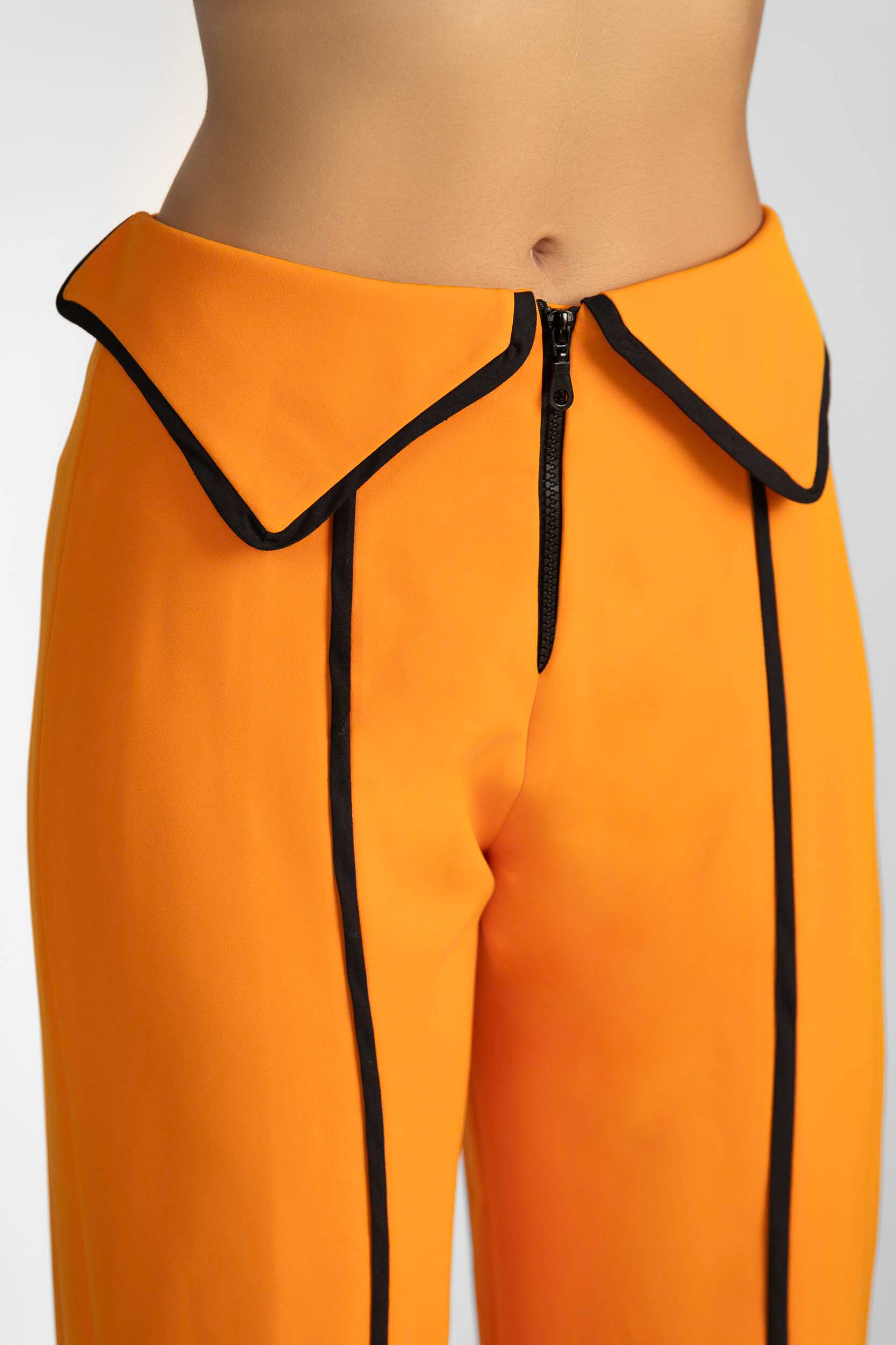 Orange Straight leg pants, with dtripe details, collar on the waist and zipper, details.