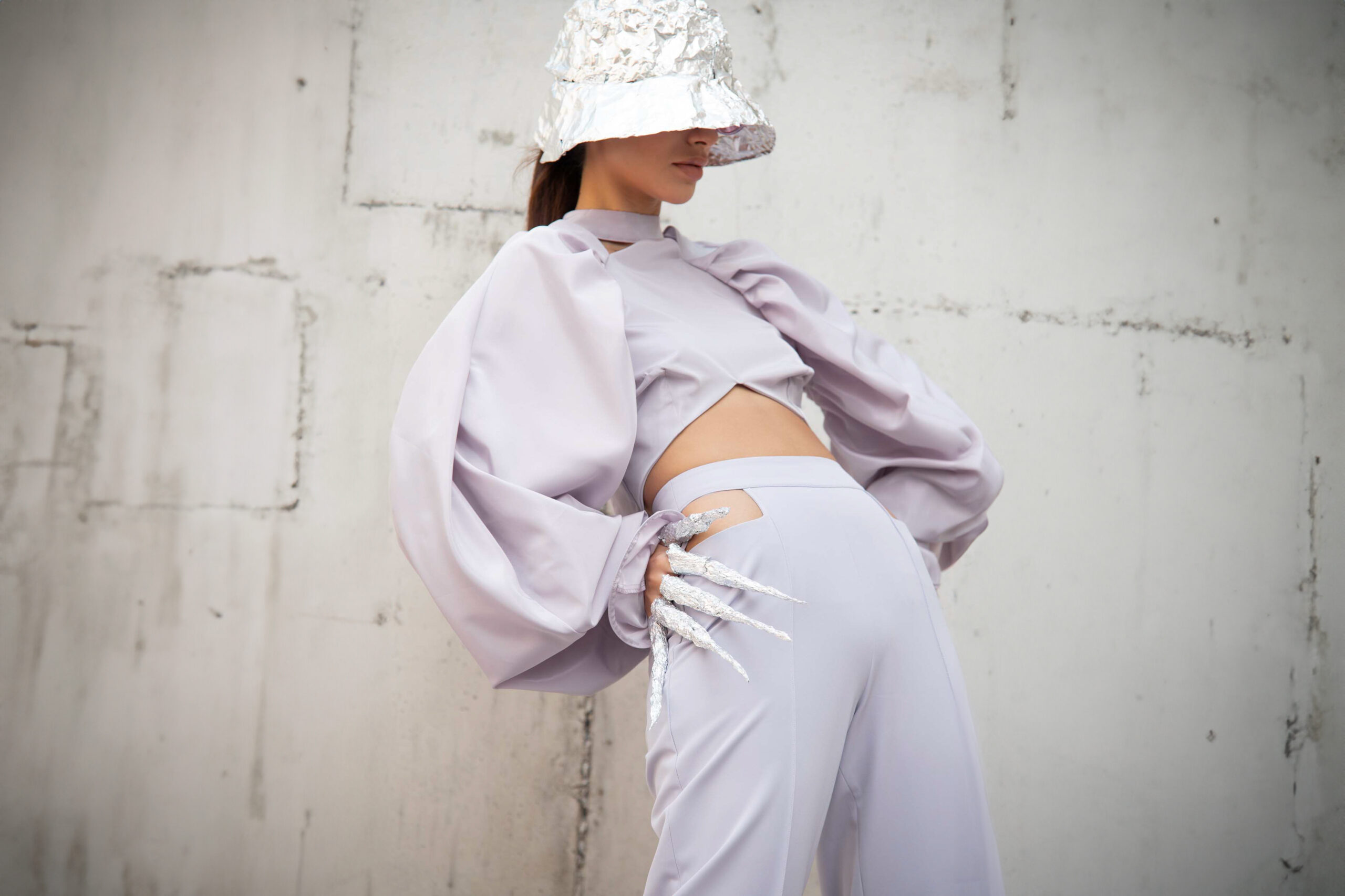 Lilac cropped top, with long gathered sleeves and ruffles at the end of them.