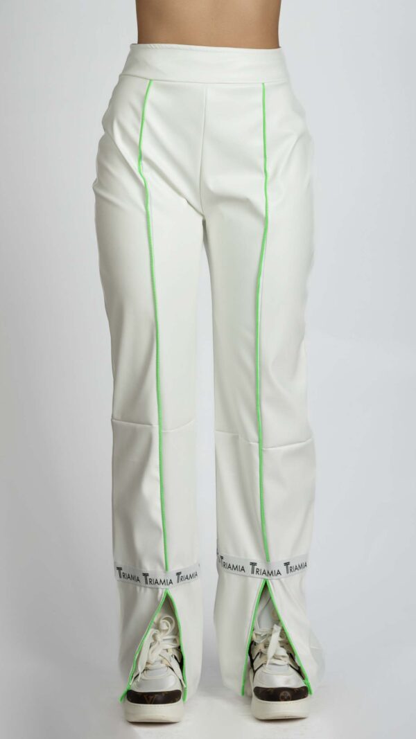 White leather trousers, with neon green stripes and split hem. Front photo.